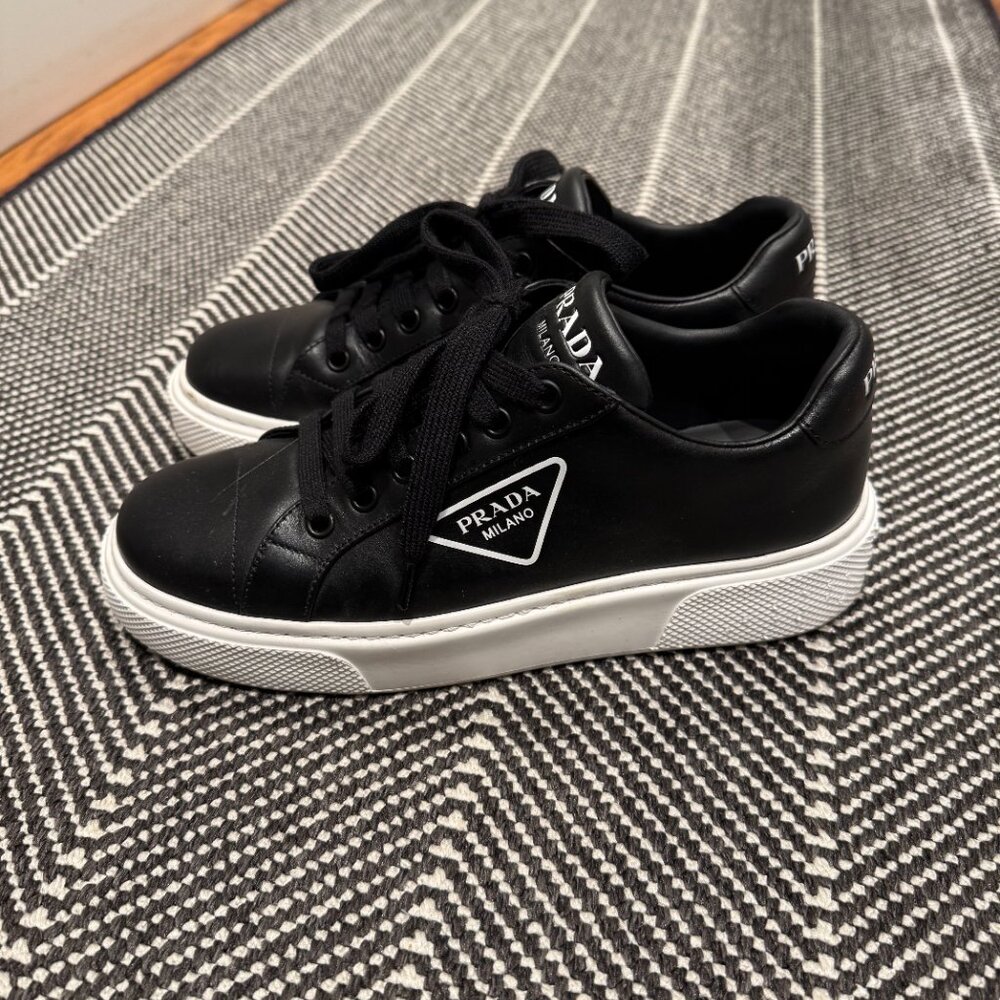 Iconic Prada sneakers (size 37) Black leather, white souls from Florence, Italy